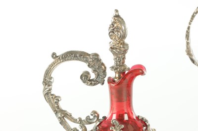 Lot 16 - TWO LATE 19TH CENTURY GLASS AND SILVER PLATED CLARET JUGS