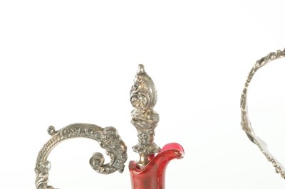 Lot 16 - TWO LATE 19TH CENTURY GLASS AND SILVER PLATED CLARET JUGS