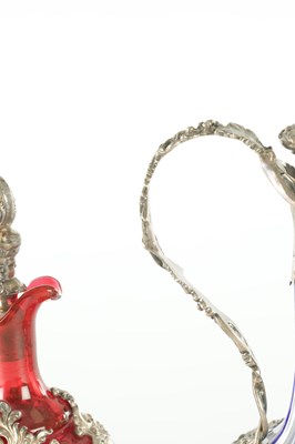 Lot 16 - TWO LATE 19TH CENTURY GLASS AND SILVER PLATED CLARET JUGS