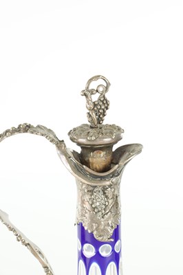 Lot 16 - TWO LATE 19TH CENTURY GLASS AND SILVER PLATED CLARET JUGS