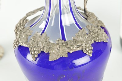 Lot 16 - TWO LATE 19TH CENTURY GLASS AND SILVER PLATED CLARET JUGS