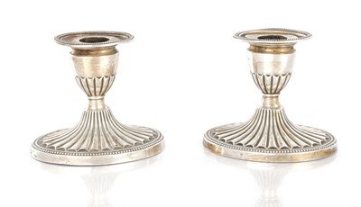 Lot 119 - A PAIR OF EDWARD VII SILVER CANDLESTICKS