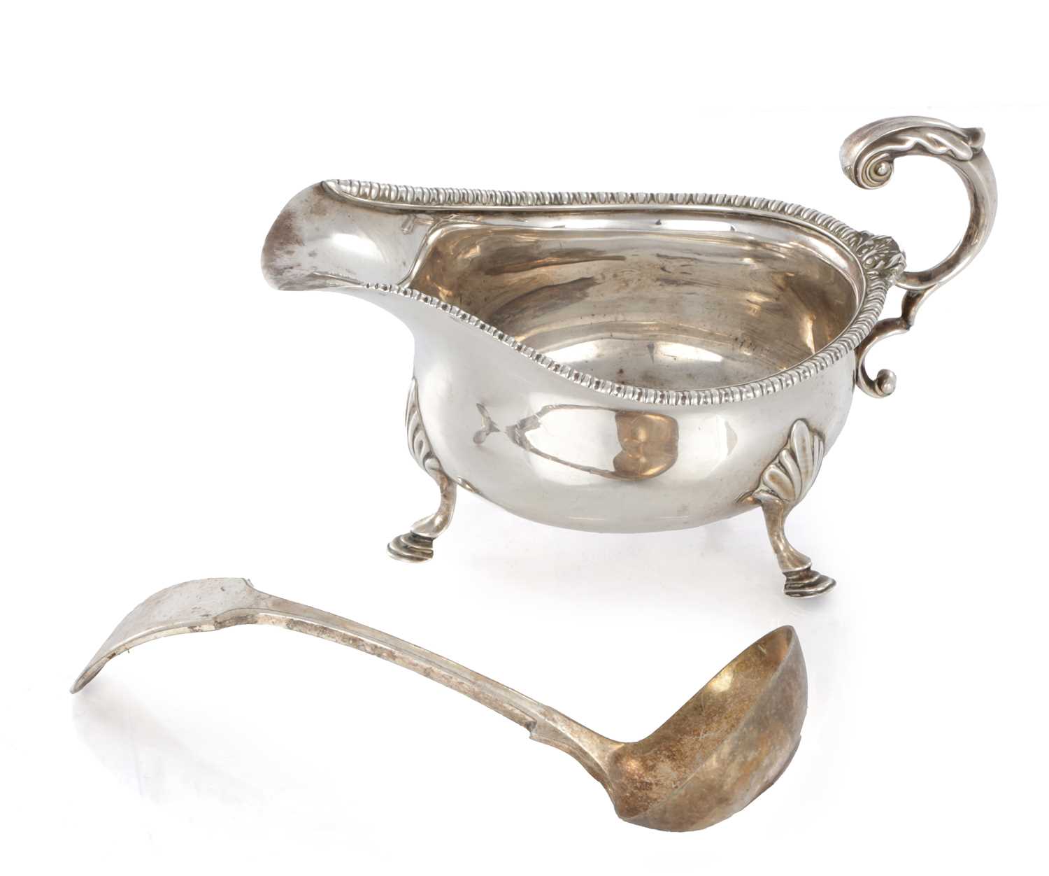 Lot 187 - A GEORGIAN SILVER SAUCEBOAT AND PLATED LADLE