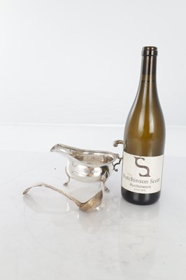 Lot 187 - A GEORGIAN SILVER SAUCEBOAT AND PLATED LADLE