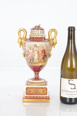 Lot 78 - A 19TH CENTURY VIENNA PORCELAIN TWO HANDLED LIDDED URN SHAPED VASE ON PEDESTAL
