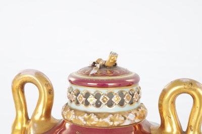 Lot 78 - A 19TH CENTURY VIENNA PORCELAIN TWO HANDLED LIDDED URN SHAPED VASE ON PEDESTAL