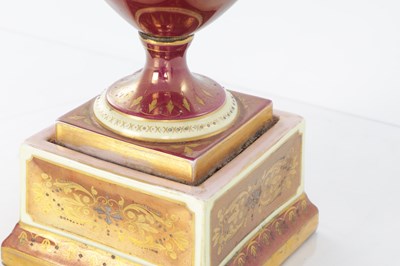 Lot 78 - A 19TH CENTURY VIENNA PORCELAIN TWO HANDLED LIDDED URN SHAPED VASE ON PEDESTAL