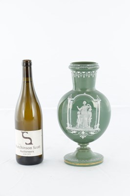 Lot 11 - AN UNUSUAL LATE 19TH CENTURY GREEN GLASS AND OPAQUE ENAMEL DECORATED VASE