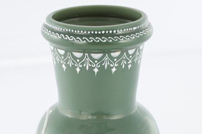 Lot 11 - AN UNUSUAL LATE 19TH CENTURY GREEN GLASS AND OPAQUE ENAMEL DECORATED VASE