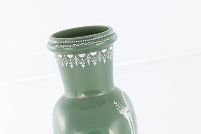 Lot 11 - AN UNUSUAL LATE 19TH CENTURY GREEN GLASS AND OPAQUE ENAMEL DECORATED VASE