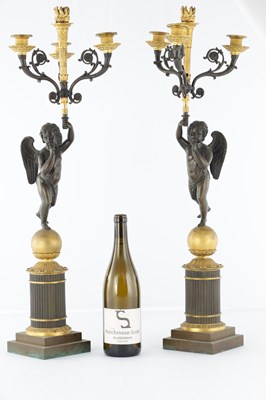 Lot 575 - A PAIR OF 19TH CENTURY FRENCH BRONZE AND GILT BRONZE FOUR BRANCH FIGURAL CANDELABRA