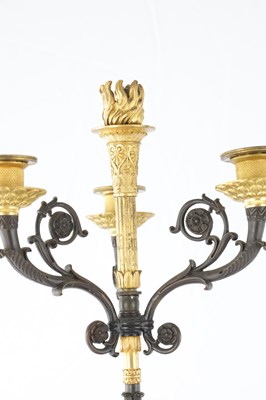 Lot 575 - A PAIR OF 19TH CENTURY FRENCH BRONZE AND GILT BRONZE FOUR BRANCH FIGURAL CANDELABRA