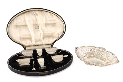 Lot 303 - A 19TH CENTURY PIERCED SILVER DISH AND A CASED SILVER CRUET SET