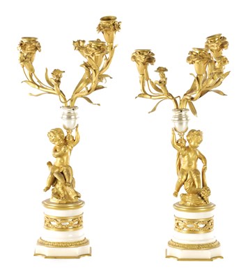 Lot 765 - A PAIR OF 19TH CENTURY FRENCH GILT ORMOLU AND SILVER HIGH-LIGHTED THREE BRANCH CANDELABRA