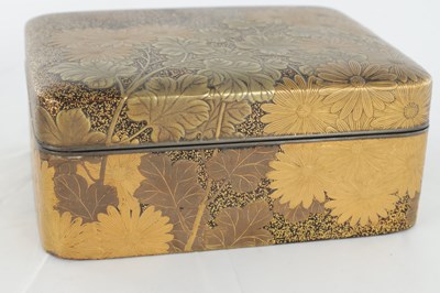 Lot 570 - A JAPANESE MEIJI PERIOD GILT LACQUERED RECTANGULAR BOX AND COVER