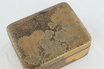 Lot 570 - A JAPANESE MEIJI PERIOD GILT LACQUERED RECTANGULAR BOX AND COVER