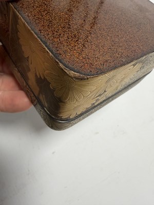 Lot 570 - A JAPANESE MEIJI PERIOD GILT LACQUERED RECTANGULAR BOX AND COVER