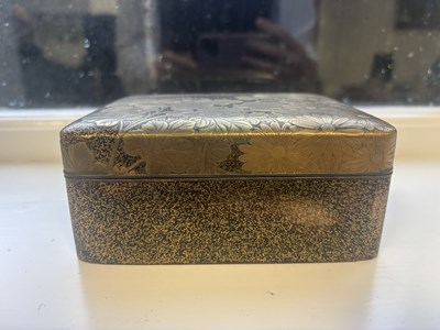 Lot 570 - A JAPANESE MEIJI PERIOD GILT LACQUERED RECTANGULAR BOX AND COVER