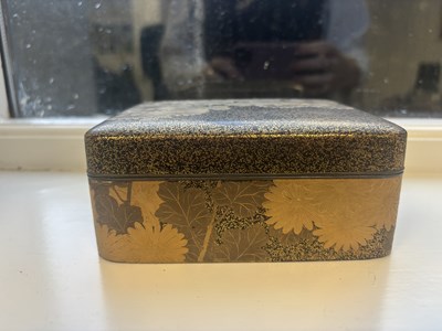 Lot 570 - A JAPANESE MEIJI PERIOD GILT LACQUERED RECTANGULAR BOX AND COVER