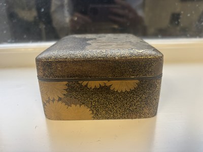 Lot 570 - A JAPANESE MEIJI PERIOD GILT LACQUERED RECTANGULAR BOX AND COVER