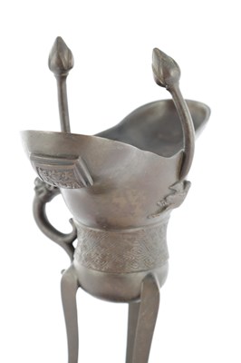 Lot 470 - AN EARLY CHINESE ARCHAISTIC BRONZE TRIPOD VESSEL