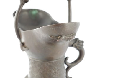 Lot 470 - AN EARLY CHINESE ARCHAISTIC BRONZE TRIPOD VESSEL