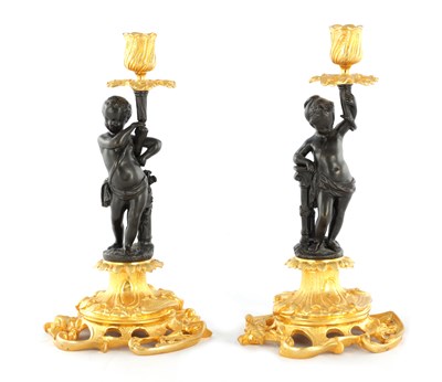 Lot 800 - A PAIR OF LATE 19TH CENTURY FRENCH BRONZE AND ORMOLU FIGURAL CANDLESTICKS