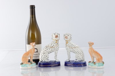 Lot 28 - TWO PAIRS OF 19TH CENTURY STAFFORDSHIRE DOGS