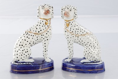 Lot 28 - TWO PAIRS OF 19TH CENTURY STAFFORDSHIRE DOGS