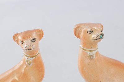 Lot 28 - TWO PAIRS OF 19TH CENTURY STAFFORDSHIRE DOGS