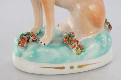 Lot 28 - TWO PAIRS OF 19TH CENTURY STAFFORDSHIRE DOGS