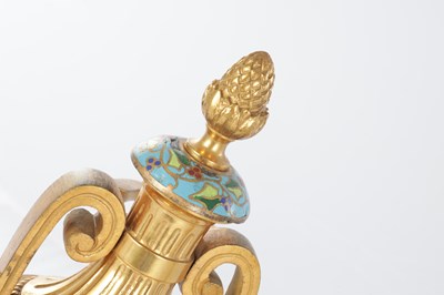 Lot 681 - A PAIR OF LATE 19TH CENTURY FRENCH ORMOLU AND CHAMPLEVE ENAMELLED FIRE DOGS