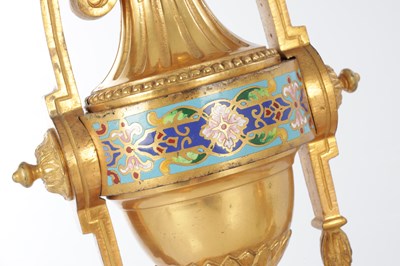 Lot 681 - A PAIR OF LATE 19TH CENTURY FRENCH ORMOLU AND CHAMPLEVE ENAMELLED FIRE DOGS