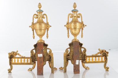 Lot 681 - A PAIR OF LATE 19TH CENTURY FRENCH ORMOLU AND CHAMPLEVE ENAMELLED FIRE DOGS