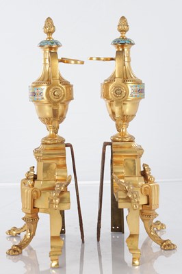 Lot 681 - A PAIR OF LATE 19TH CENTURY FRENCH ORMOLU AND CHAMPLEVE ENAMELLED FIRE DOGS