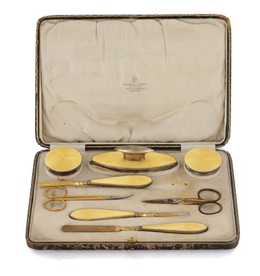 Lot 233 - A 1920'S STERLING SILVER AND GUILLOCHE ENAMEL MANICURE CASED SET