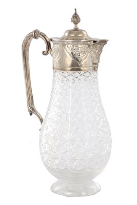 Lot 230 - AN EARLY 20TH CENTURY SILVER TOPPED AND CUT GLASS CLARET JUG