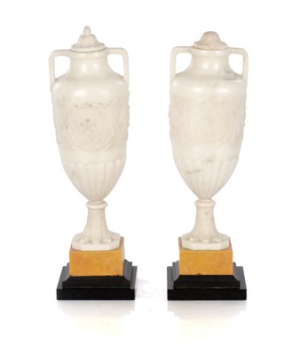 Lot 879 - A PAIR 19TH CENTURY ITALIAN GRAND TOUR CARVED CARRARA MARBLE URNS