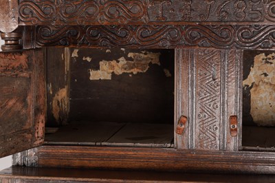 Lot 1578 - A 17TH CENTURY WESTMORLAND CARVED OAK DATED COURT CUPBOARD