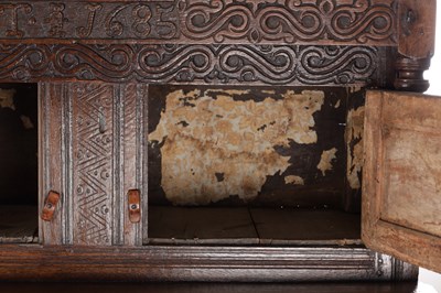 Lot 1578 - A 17TH CENTURY WESTMORLAND CARVED OAK DATED COURT CUPBOARD