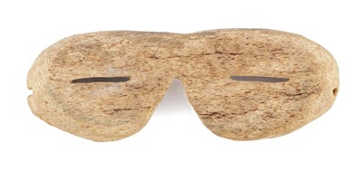 Lot 882 - A PAIR OF CARVED BONE INUIT SNOW GOGGLES