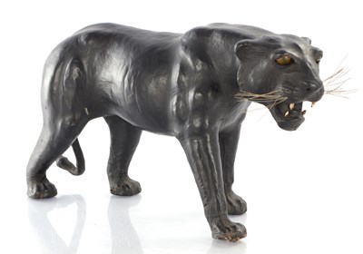 Lot 910 - A VINTAGE LEATHER BOUND SCULPTURE OF A LION