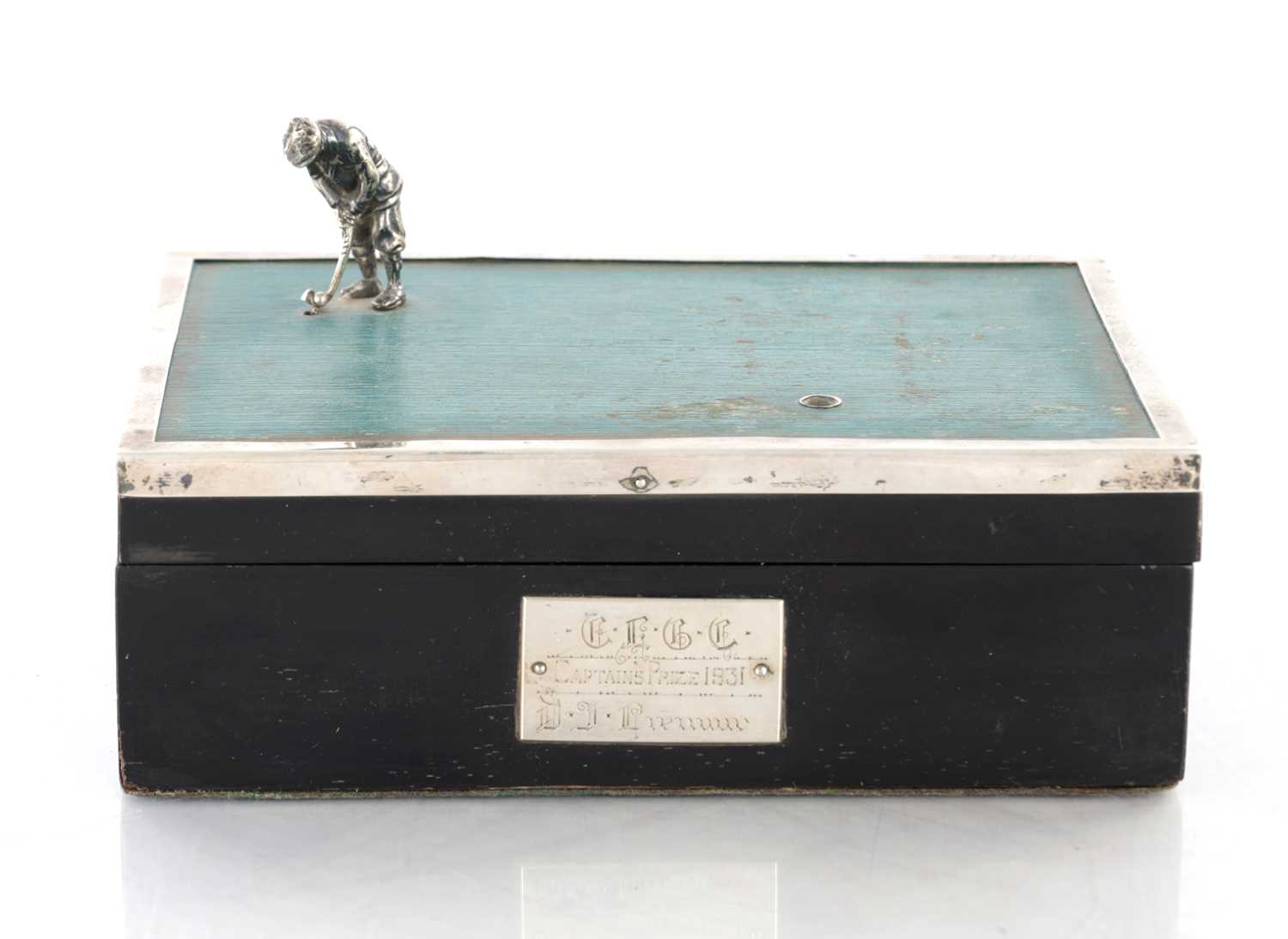 Lot 183 - A 1930’S SILVER AND EBONY VENEERED GOLFER CIGARETTE BOX