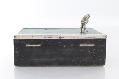 Lot 183 - A 1930’S SILVER AND EBONY VENEERED GOLFER CIGARETTE BOX