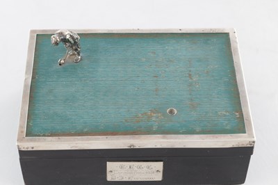 Lot 183 - A 1930’S SILVER AND EBONY VENEERED GOLFER CIGARETTE BOX