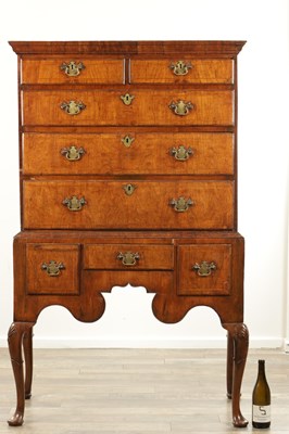 Lot 1307 - A QUEEN ANNE FIGURED WALNUT CHEST OF STAND