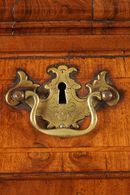Lot 1307 - A QUEEN ANNE FIGURED WALNUT CHEST OF STAND
