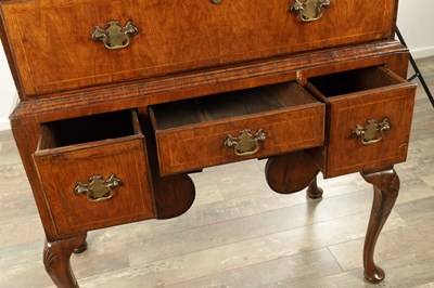 Lot 1307 - A QUEEN ANNE FIGURED WALNUT CHEST OF STAND