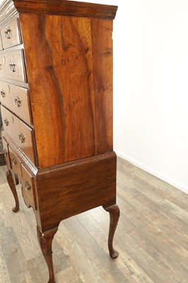 Lot 1307 - A QUEEN ANNE FIGURED WALNUT CHEST OF STAND