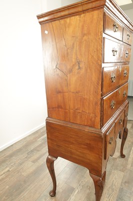 Lot 1307 - A QUEEN ANNE FIGURED WALNUT CHEST OF STAND